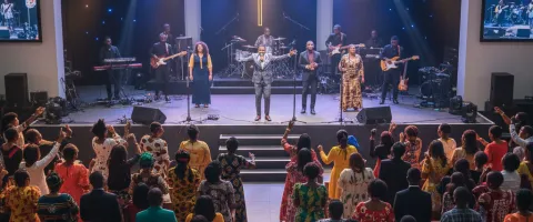 A church auditorium with singers on the stage
